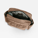 Open Freya stroller organiser in Mocha from above, showing the grey lining and a bottle in the side pocket