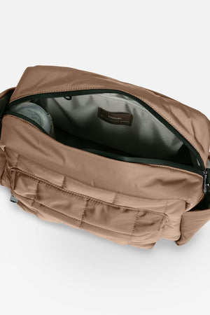 Open Freya stroller organiser in Mocha from above, showing the grey lining and a bottle in the side pocket