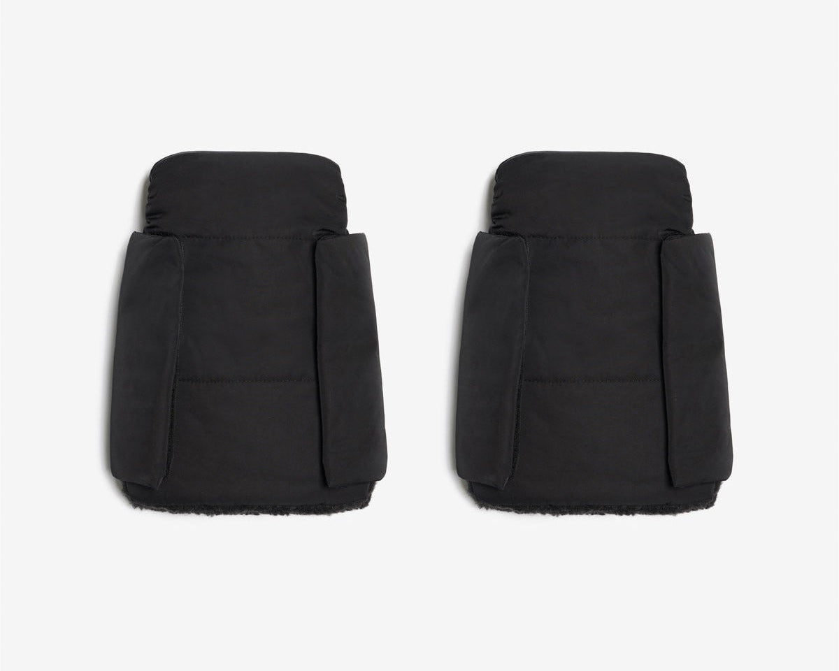 Pair of black puffer shorts on a white background