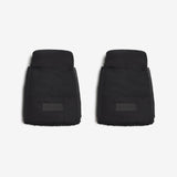 Two black car floor mats on a white background
