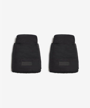 Two black car floor mats on a white background