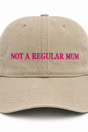 Beige cap with 'Not a Regular Mum' text in pink on a white background