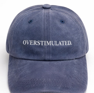 Blue cap with 'OVERSTIMULATED.' text on a white background
