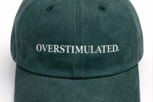Green cap with 'OVERSTIMULATED' text on a white background