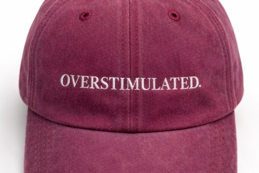 Maroon cap with 'OVERSTIMULATED' text on a white background