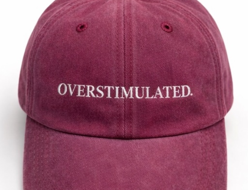 Maroon cap with 'OVERSTIMULATED' text on a white background