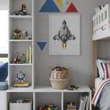 LEGO belly basket, large, filled with toy bricks on a low white shelf unit in a child's bedroom with a spaceship print