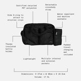 Black duffel bag shown on a light gray background with dotted callouts and text describing features such as detachable crossbody strap, water repellent and machine washable fabric, padded travel changing mat, dimensions, and internal pockets.
