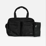A black multi-compartment duffel bag with a detachable shoulder strap and an attached black pouch on the side, shown against a light gray background.