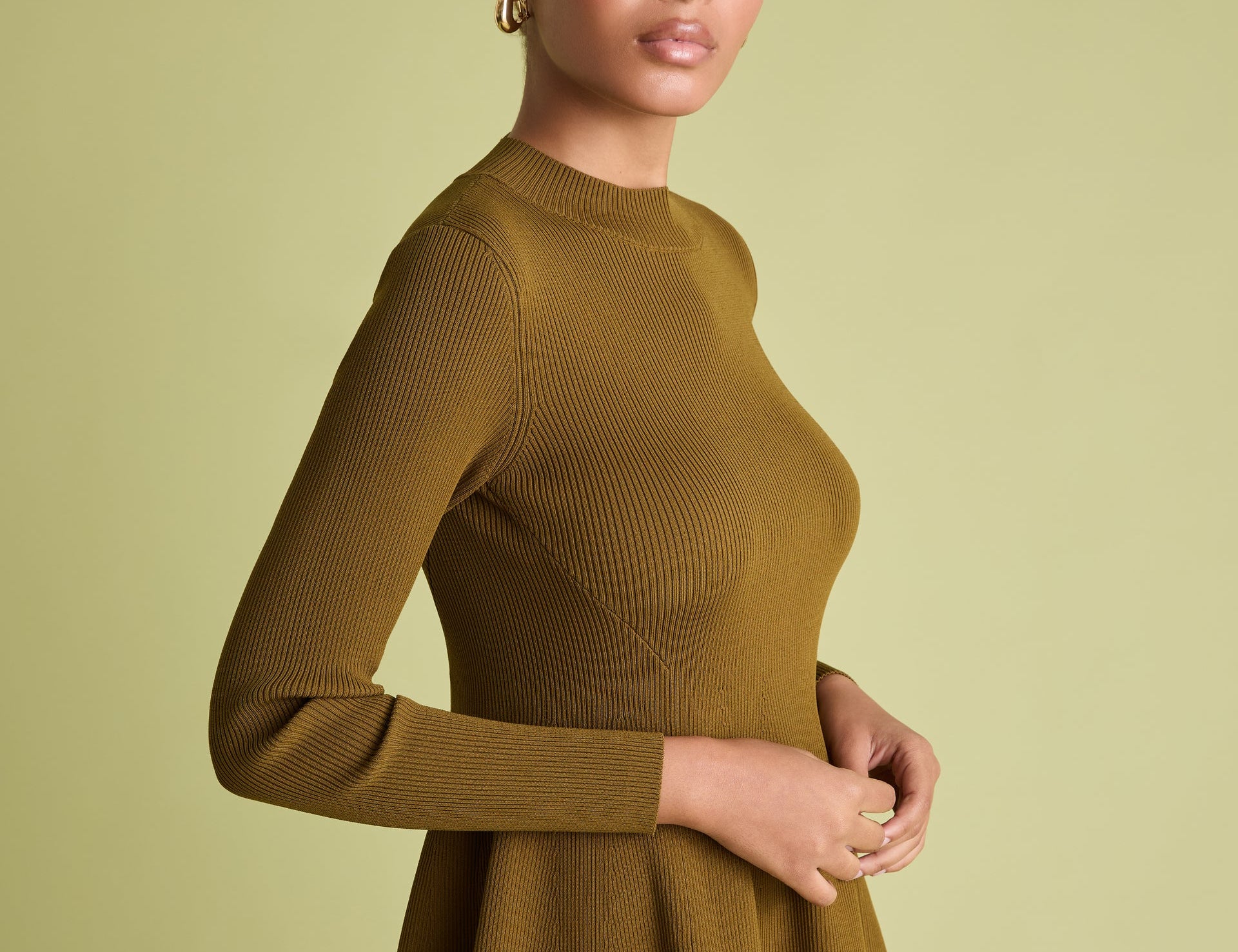 Peplum ribbed jumper in khaki on woman
