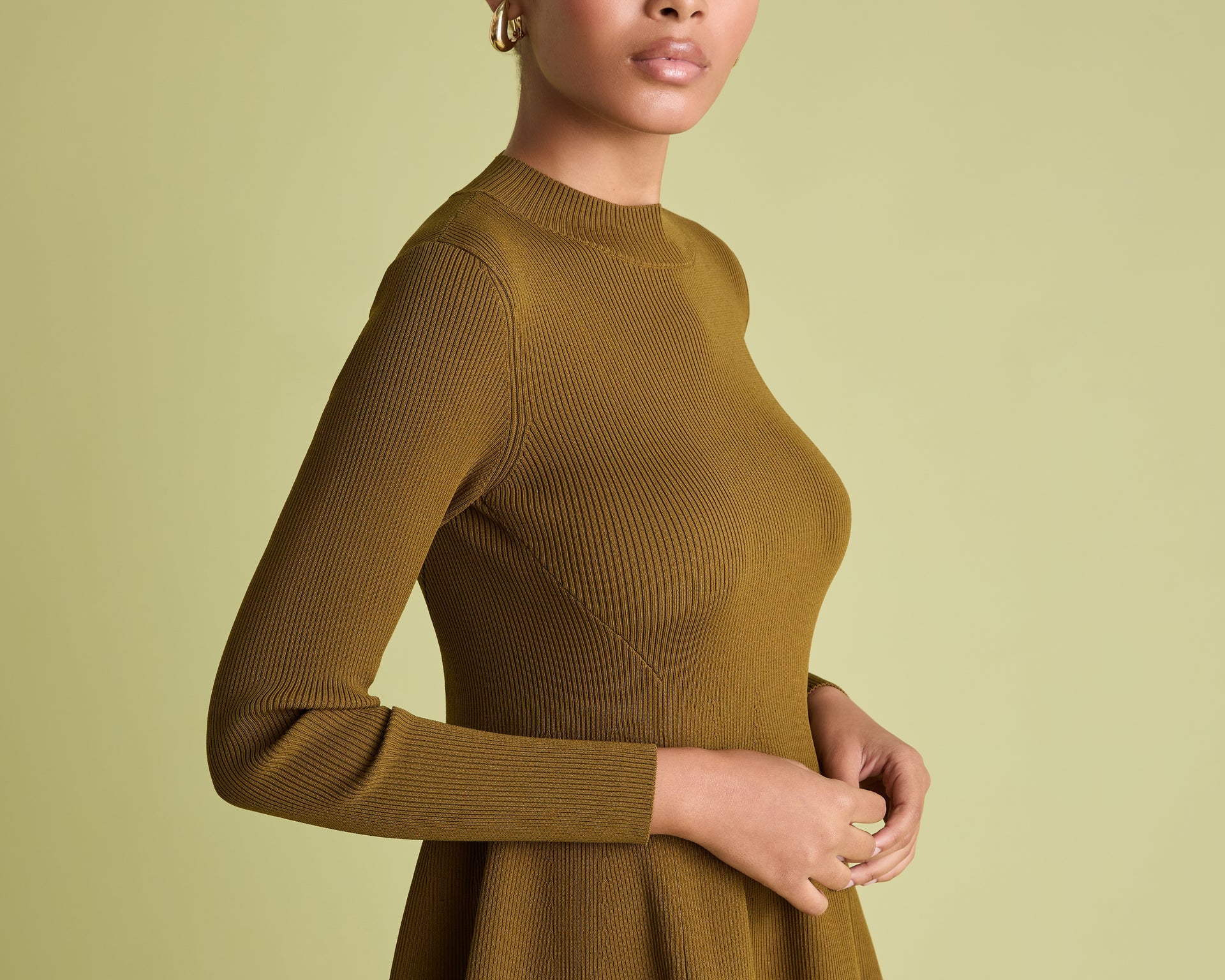 Peplum ribbed jumper in khaki on woman