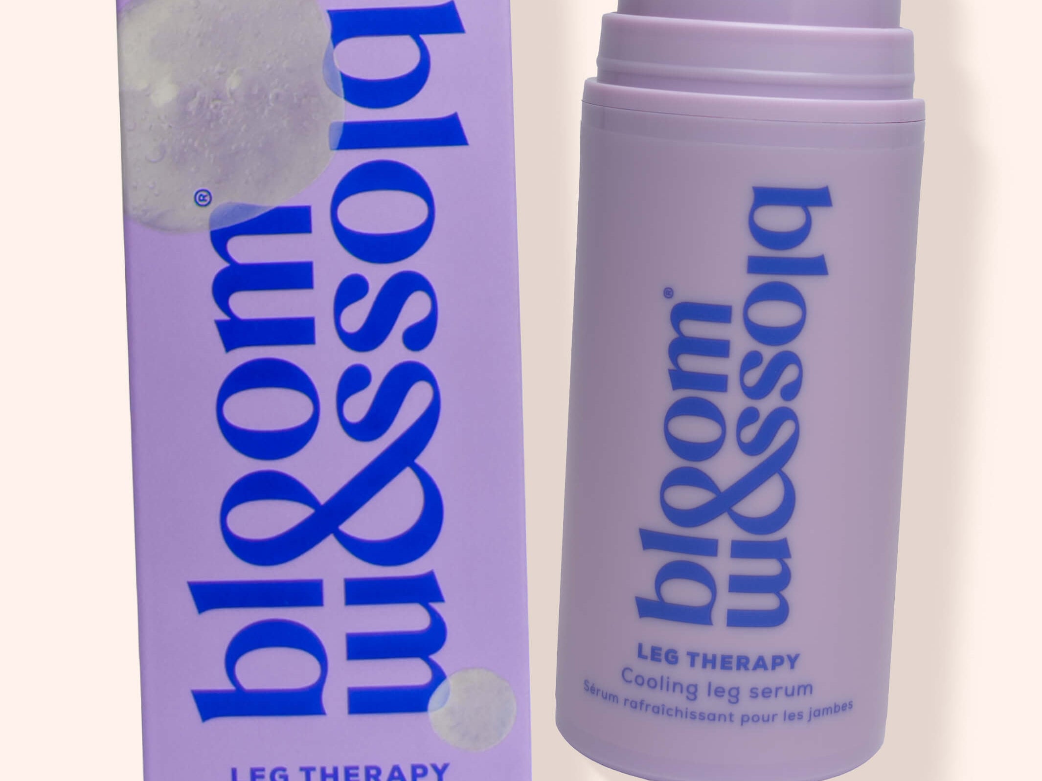 A lavender pump bottle and matching box of bloom blossom leg therapy cooling leg serum on a light beige background.