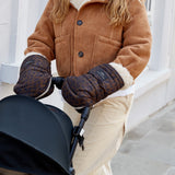 Woman pushing a stroller with her hands in the Astrid stroller mittens in Chocolate Leopard