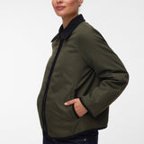 Pregnant woman wearing Khaki green short jacket with black collar and zip front