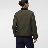 Back of Pregnant woman wearing Khaki green short jacket with black collar and zip front