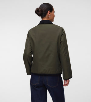 Back of Pregnant woman wearing Khaki green short jacket with black collar and zip front