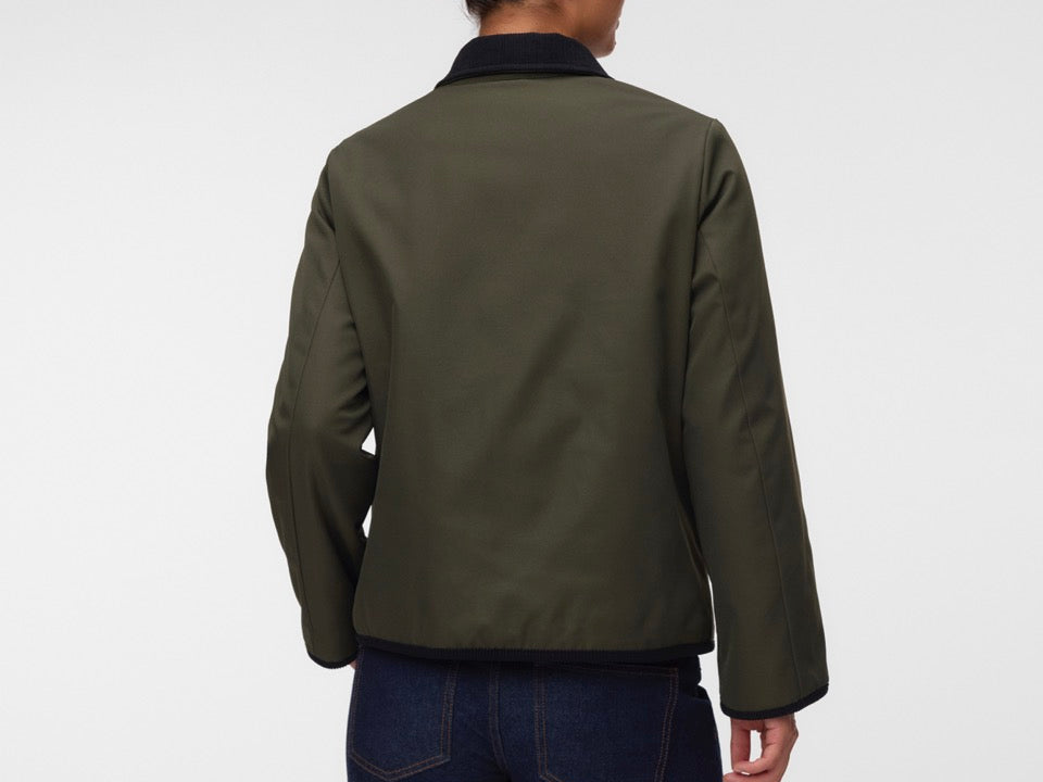 Back of Pregnant woman wearing Khaki green short jacket with black collar and zip front