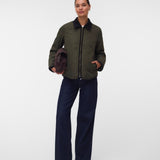 Pregnant woman wearing Khaki green short jacket with black collar and zip front 2