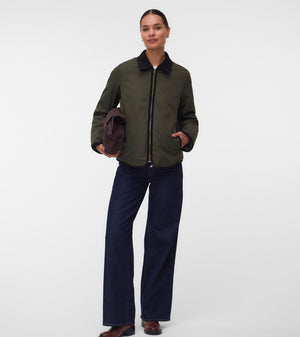 Pregnant woman wearing Khaki green short jacket with black collar and zip front 2