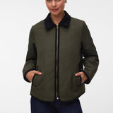 Pregnant woman wearing Khaki green short jacket with black collar and zip front