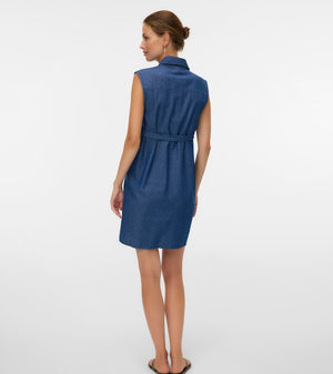 Woman wearing a blue dress on a white background