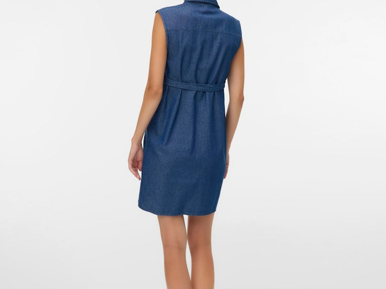 Woman wearing a blue dress on a white background