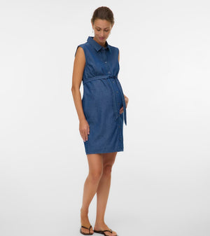 Woman wearing a blue dress on a white background