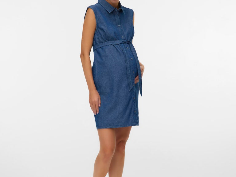 Woman wearing a blue dress on a white background