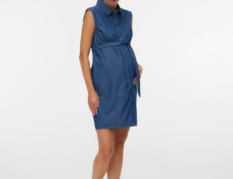 Woman wearing a blue dress on a white background