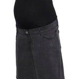 Black denim shorts worn over a black maternity top on a white background