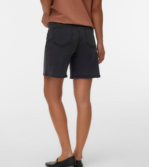 Person wearing black shorts on a white background