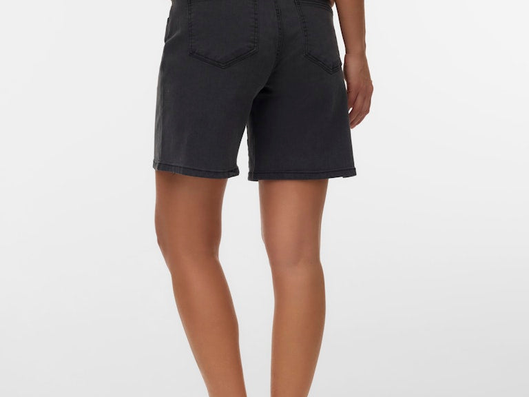 Person wearing black shorts on a white background