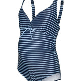Navy and white striped maternity swimsuit on a white background