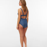 Woman wearing a blue and white striped swimsuit on a white background