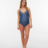 Woman wearing a blue striped swimsuit on a white background
