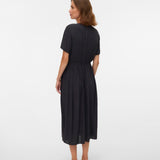 Woman wearing a black dress on a white background