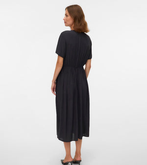 Woman wearing a black dress on a white background