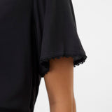 Black sleeveless top with lace trim on a white background