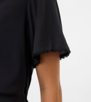 Black sleeveless top with lace trim on a white background