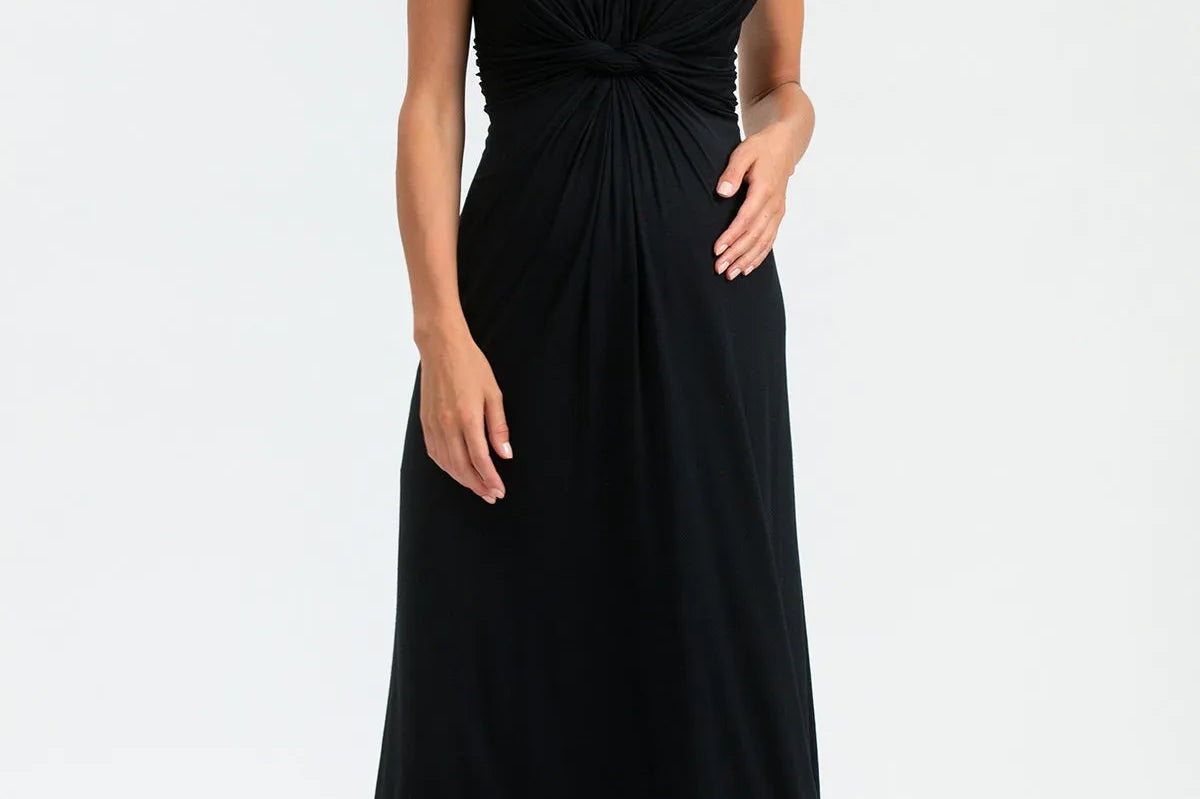 Woman wearing a black sleeveless dress on a white background
