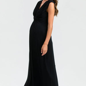 Woman wearing a black sleeveless dress on a white background