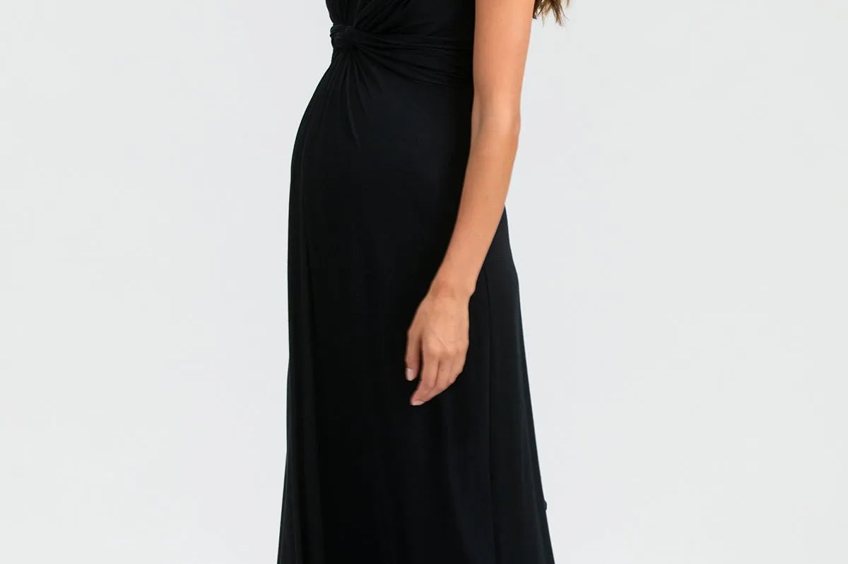 Woman wearing a black sleeveless dress on a white background
