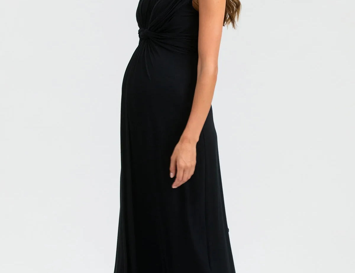 Woman wearing a black sleeveless dress on a white background