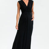 Woman wearing a black sleeveless dress on a white background
