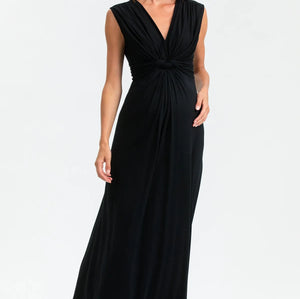 Woman wearing a black sleeveless dress on a white background