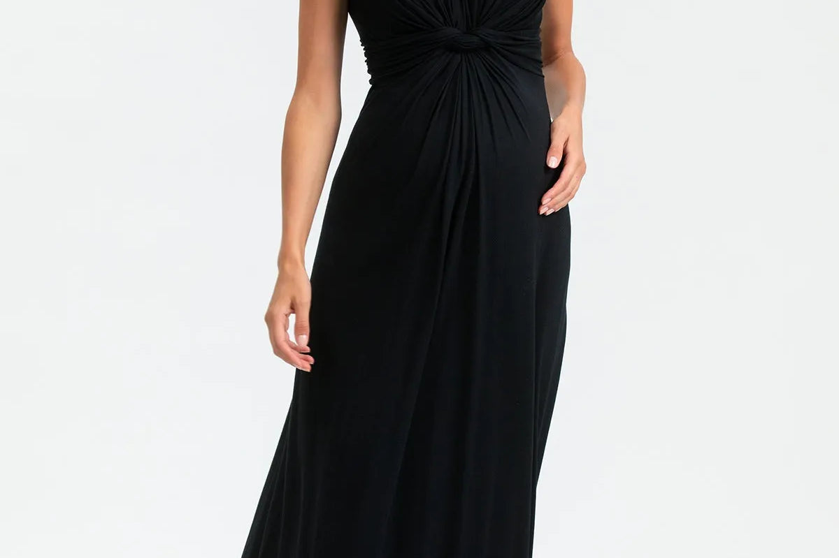Woman wearing a black sleeveless dress on a white background