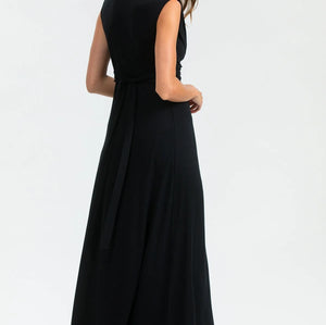 Woman wearing a black sleeveless dress on a white background