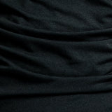 Black Helena nursing dress, close-up of the soft gathered fabric folds