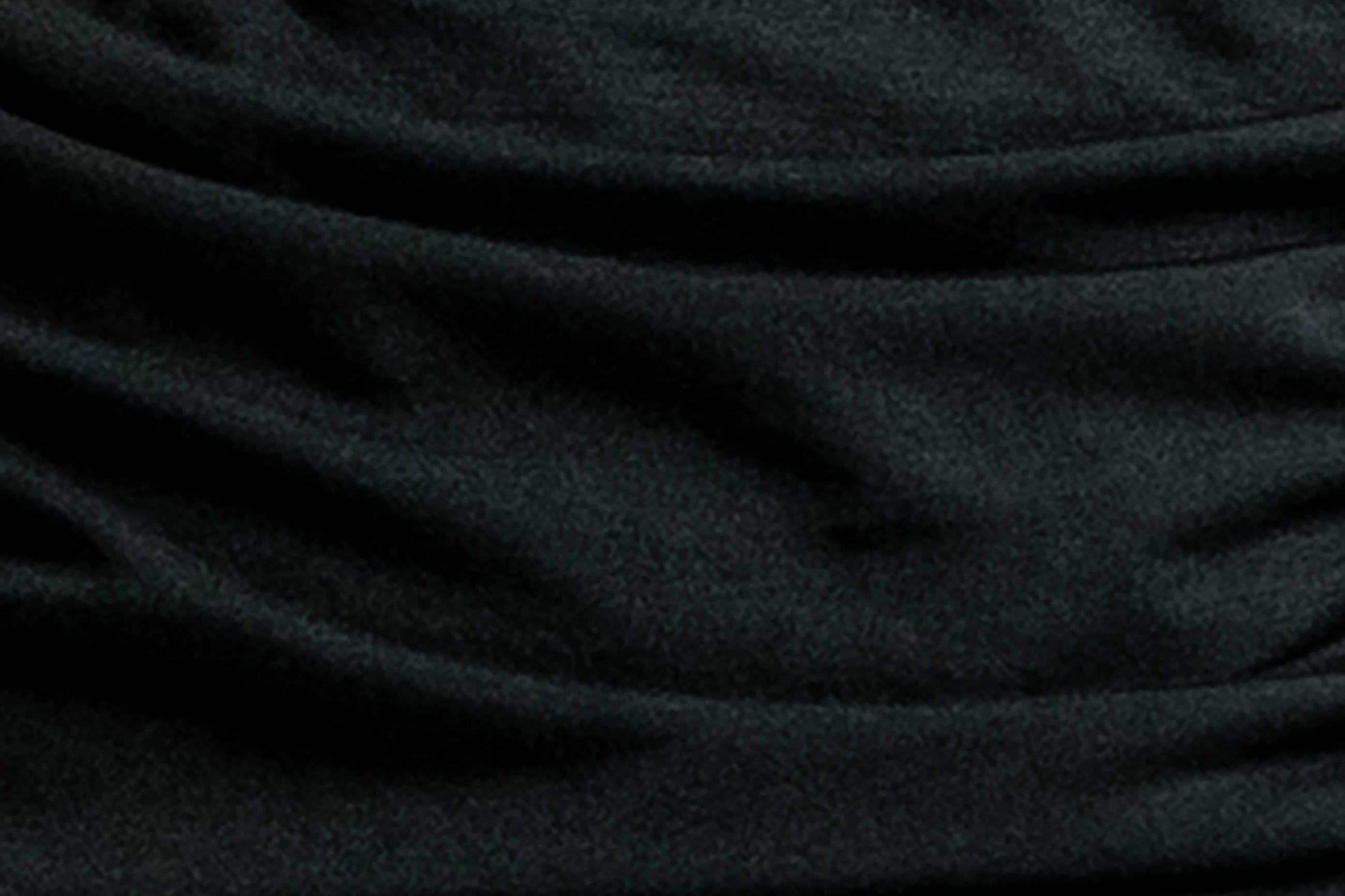 Black Helena nursing dress, close-up of the soft gathered fabric folds