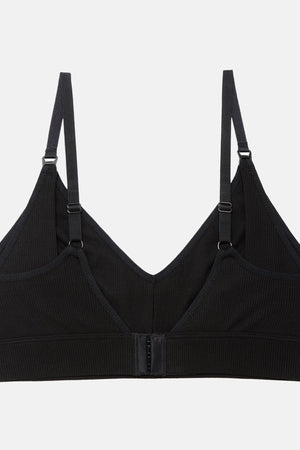 A black ribbed wireless bralette with adjustable shoulder straps and a central hook-and-eye closure, displayed against a light gray background.